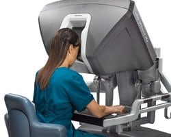 Surgeon sitting at the da Vinci Xi surgeon console