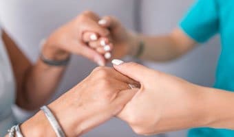 Mental Health Professional Holding hands with a patient