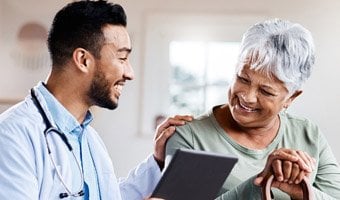 Senior woman speaking with her doctor