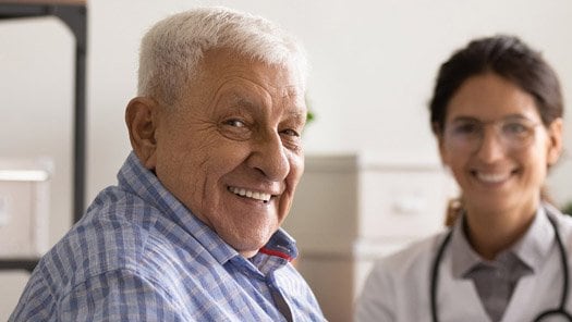 Patient sitting with their clinical provider