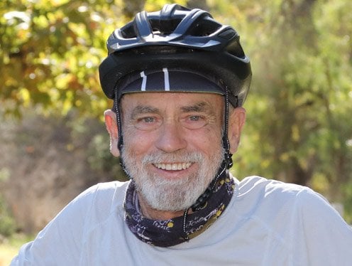 Heart patient, Patrick, riding his bicycle